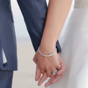 Wychmere wedding couple holding hands on the beach