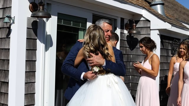 Bride hugs dad at Edgartown, MA church before her wedding