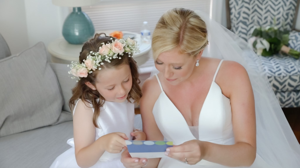 Popponesset Inn Bride sharing a moment with her flower girl